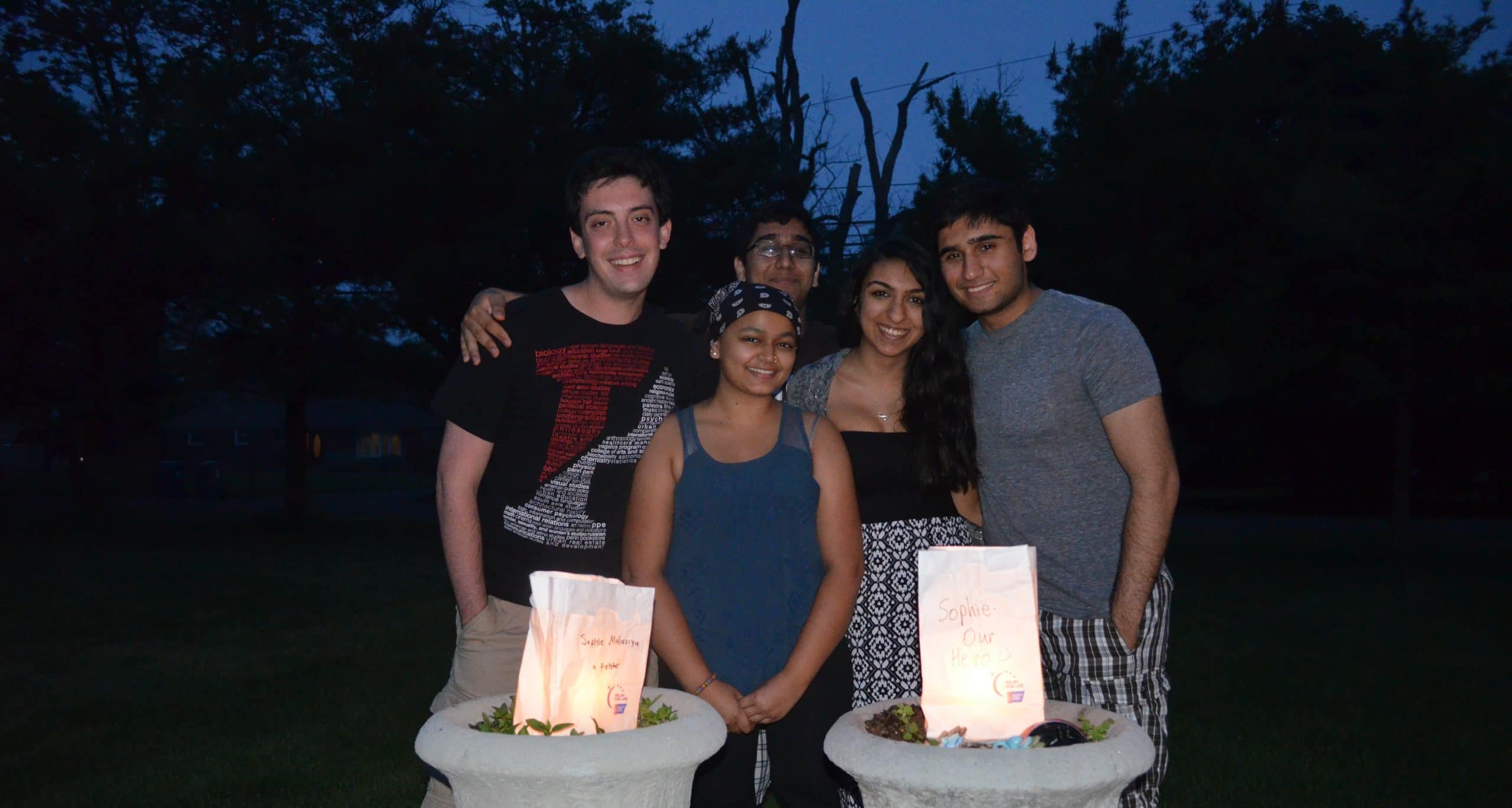 Sophie with friends at a luminaria ceremony